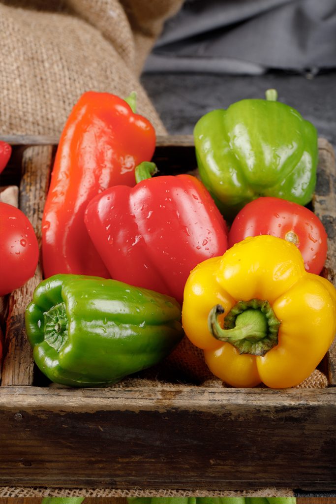 Color bell peppers rustic tray with water drops them 683x1024